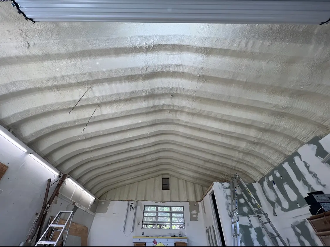 Spray polyurethane foam applied to the underside of a metal roof deck in Lacey
